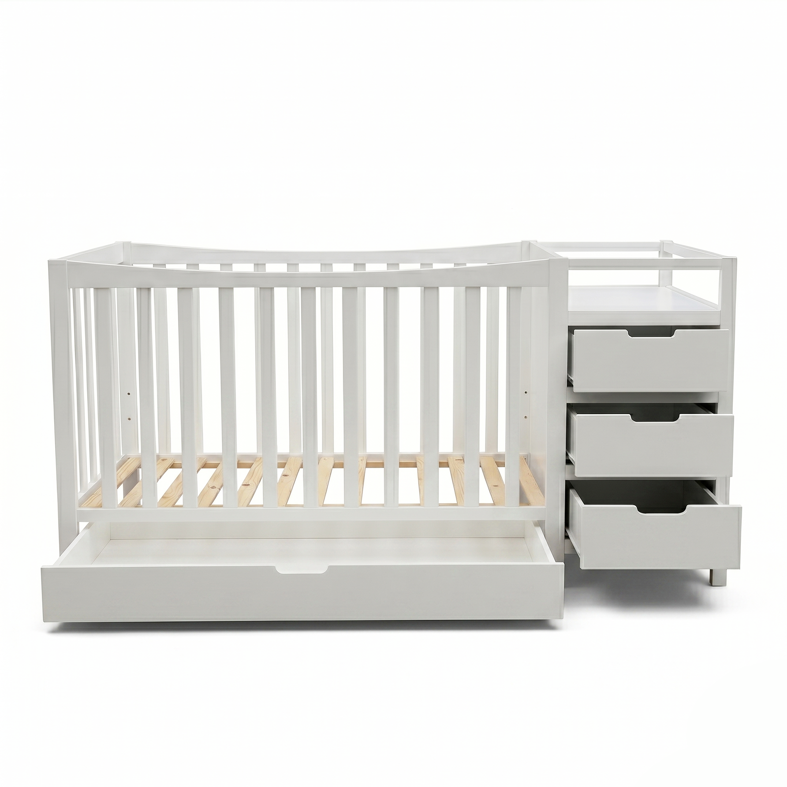 White baby crib with drawers and shelf on a white background