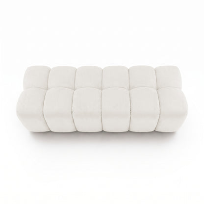 Light beige tufted rectangular bench viewed from above on a white background