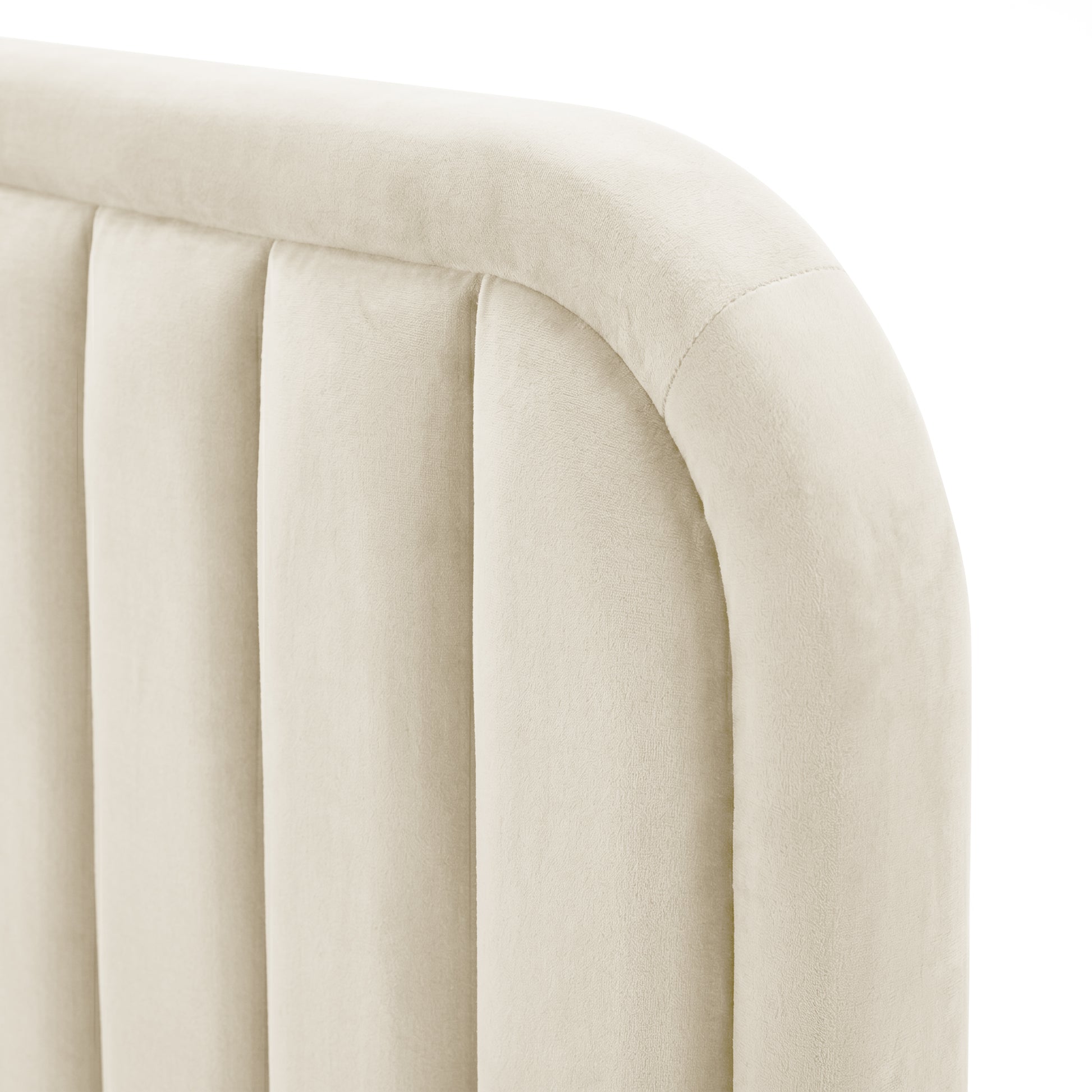 Close-up of upholstered headboard corner showing vertical channels