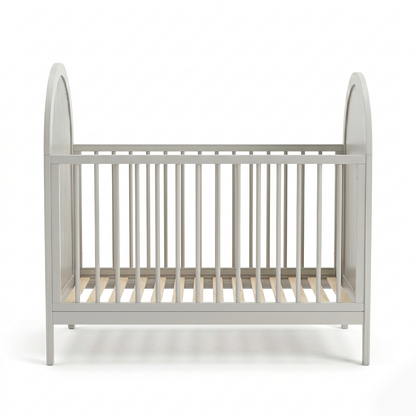 Front view of light grey baby crib on white background