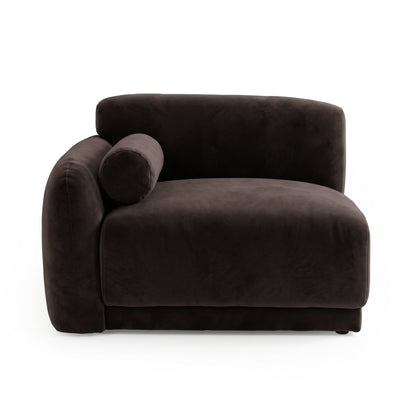 Plush dark brown armchair with velvet upholstery on white background
