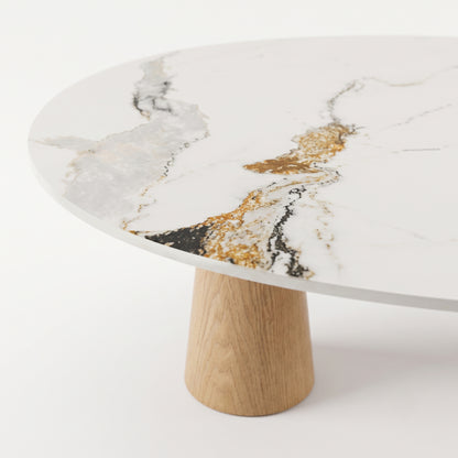 Close view of a marble-effect coffee table top and part of its wooden base on a white background