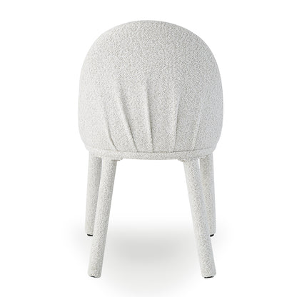 Joren Boucle Arched Dining Chair Set of 2 in Cream, featuring shell-shaped backrests and textured boucle upholstery. Shot against a plain background, showcasing its stylish curves and compact, supportive design.