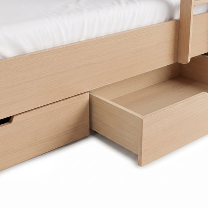 Close-up of an open under-bed storage drawer on a wooden bed frame