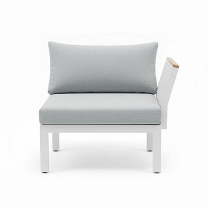 Sierra Outdoor Lounge Set in Grey: A single-seat modular sofa with a white metal frame, light-gray cushions, and a wooden-topped arm, designed for customizable outdoor comfort and style.