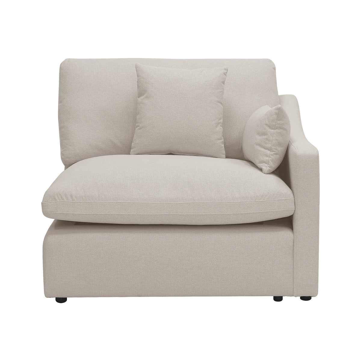 Light beige armless modular chair with pillows on a white background