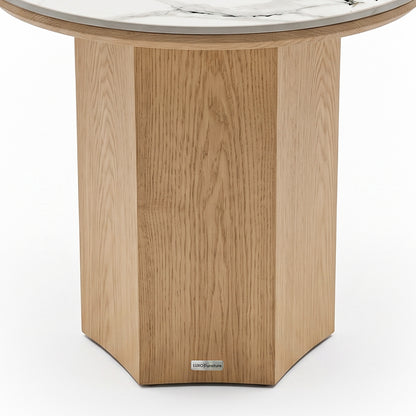 Close-up of the wooden base and lower portion of a round marble-topped table on white background