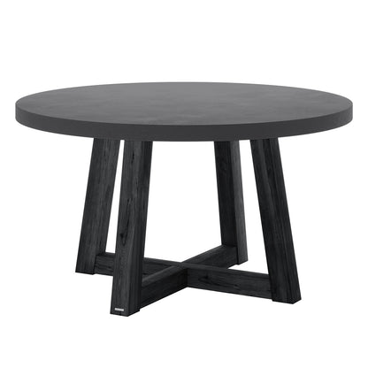 Magnus Hardwood and Concrete Outdoor Dining Table in Grey, featuring a thick round concrete top and four slightly splayed acacia wooden legs forming an X-shaped base, ideal for stylish alfresco dining.