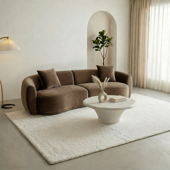 Brown sofa and white coffee table in a minimalist living room