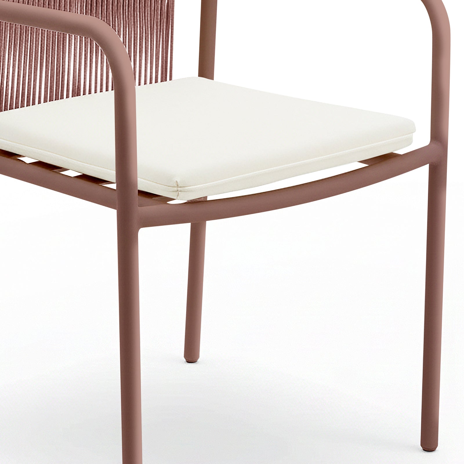 Evone 4 Seater Stone Outdoor Dining Table Set features a slim, tubular metal chair frame with a muted reddish-brown finish, white cushion, and woven backrest, highlighting modern outdoor elegance.
