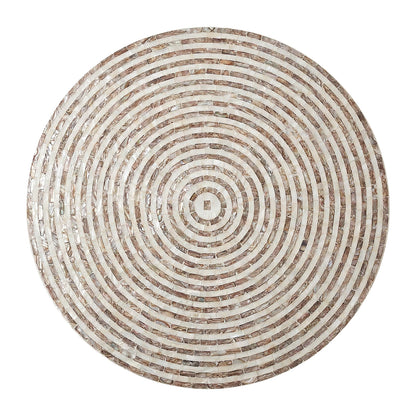 Circular mosaic tabletop with concentric rings on white background
