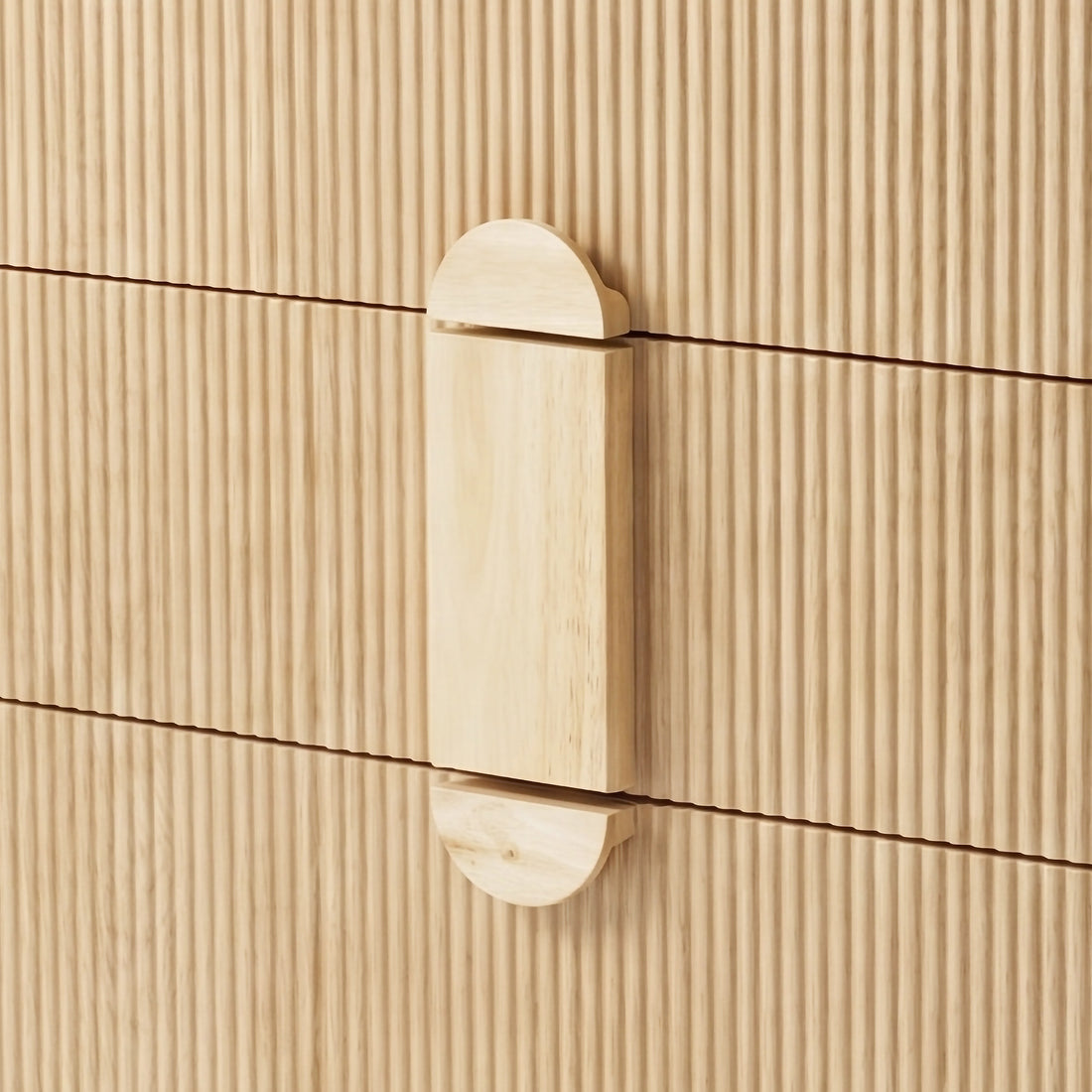 Close-up of wooden handle and fluted front panels
