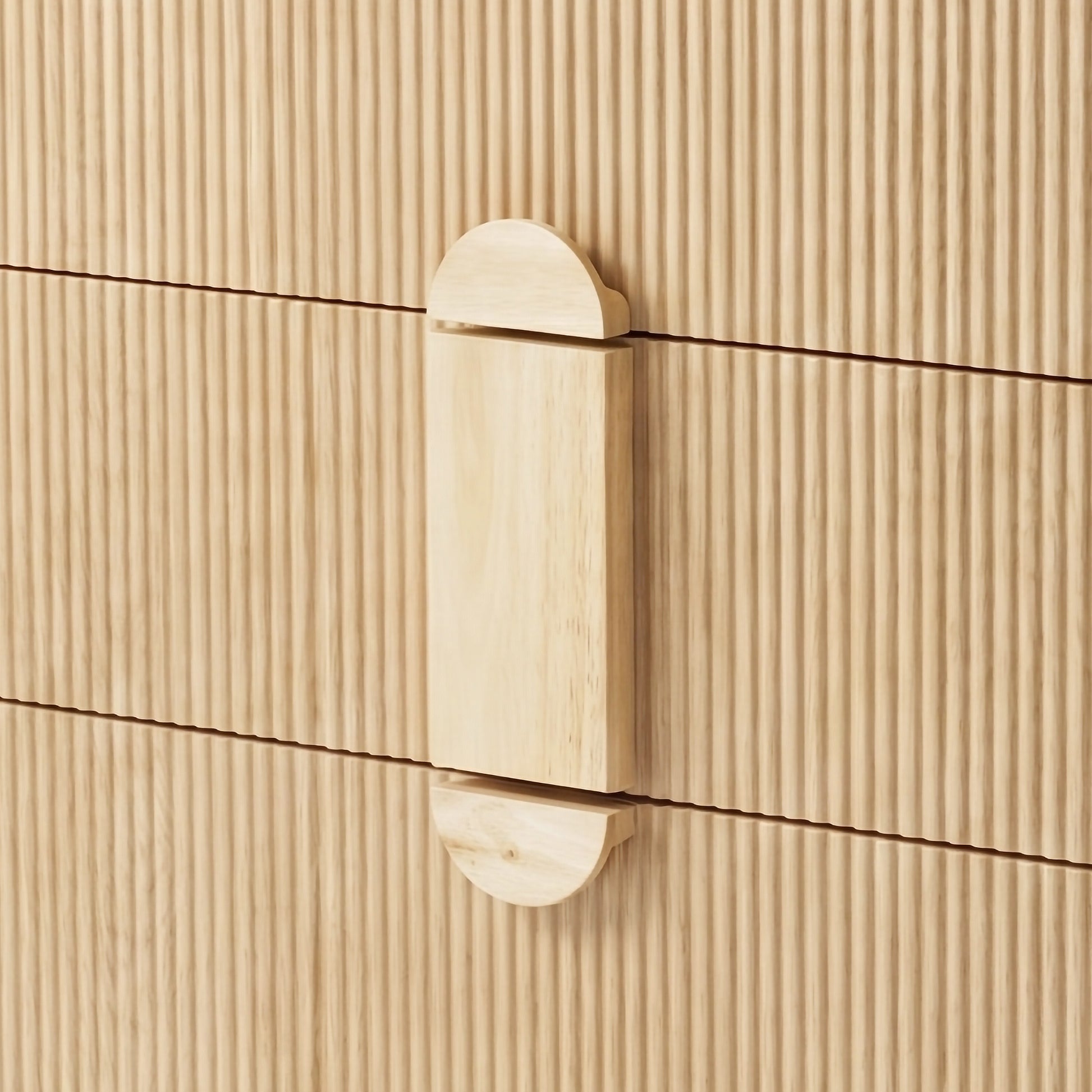 Close-up of wooden handle and fluted front panels