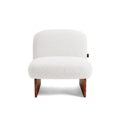 Armless accent chair on white background, front view.